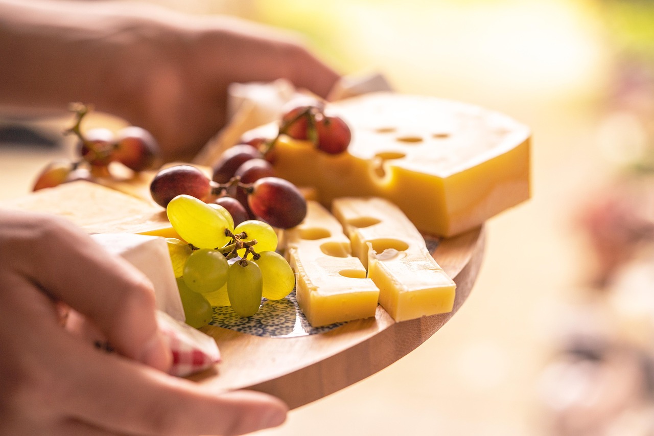 Gourmet cheese and snack board with grapes