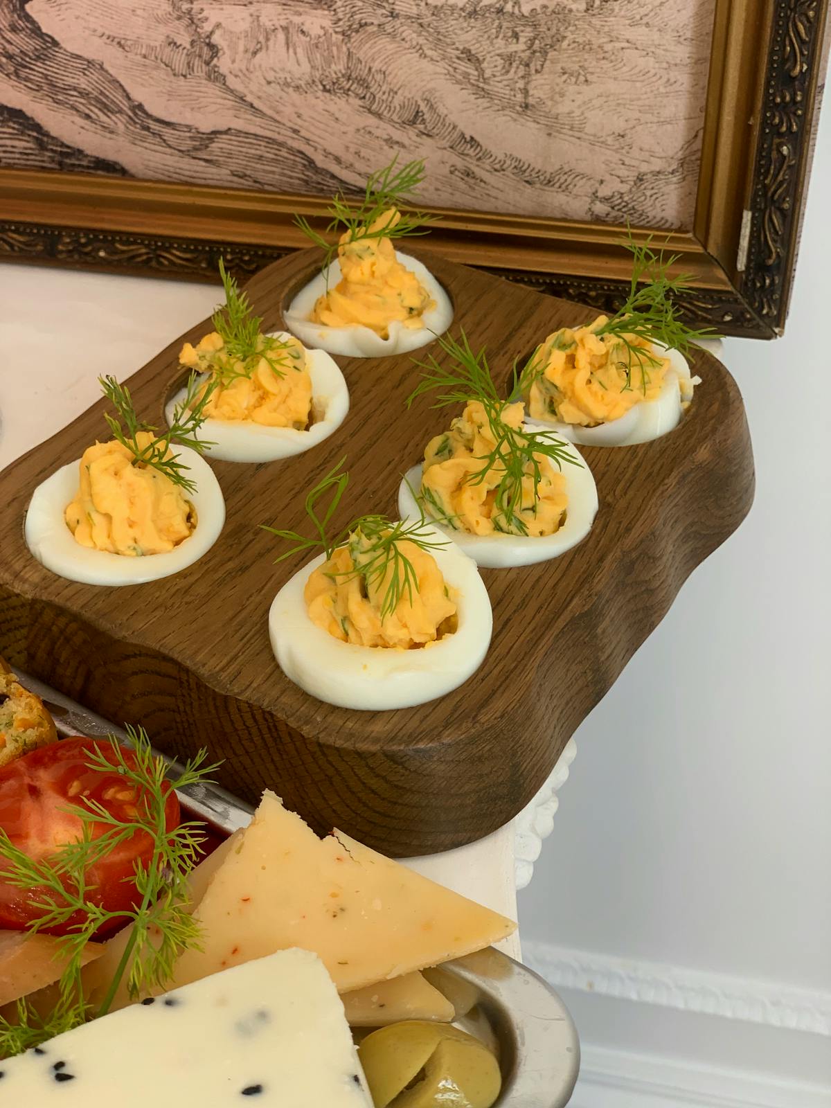 Gourmet deviled eggs on a serving platter with colorful toppings