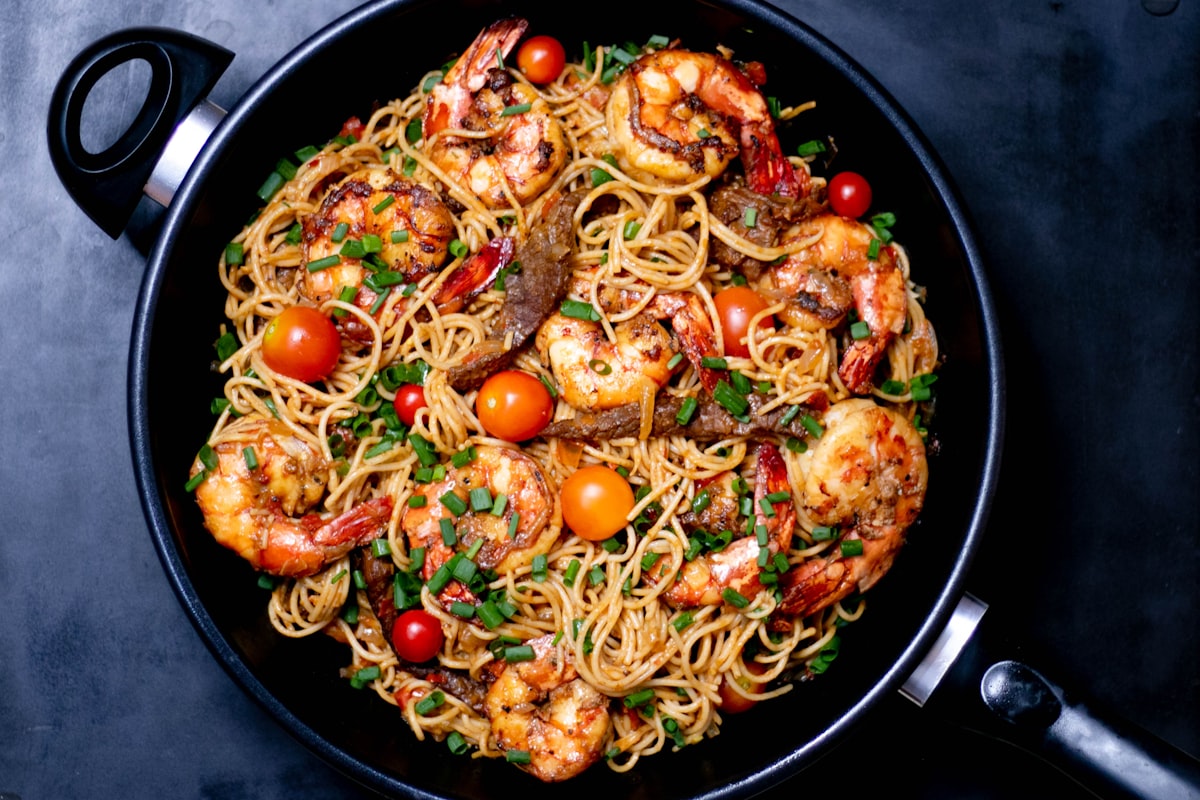 Dirty spaghetti with rich meat sauce in a skillet