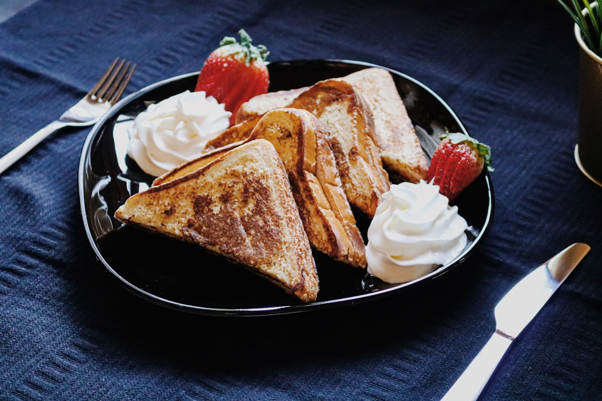 Golden toast with strawberries and whipped cream